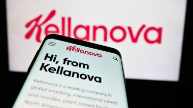 Stuttgart, Germany - 07-24-2024: Mobile phone with webpage of US food processing business Kellanova Company in front of business logo. Focus on top-left of phone display. clipart