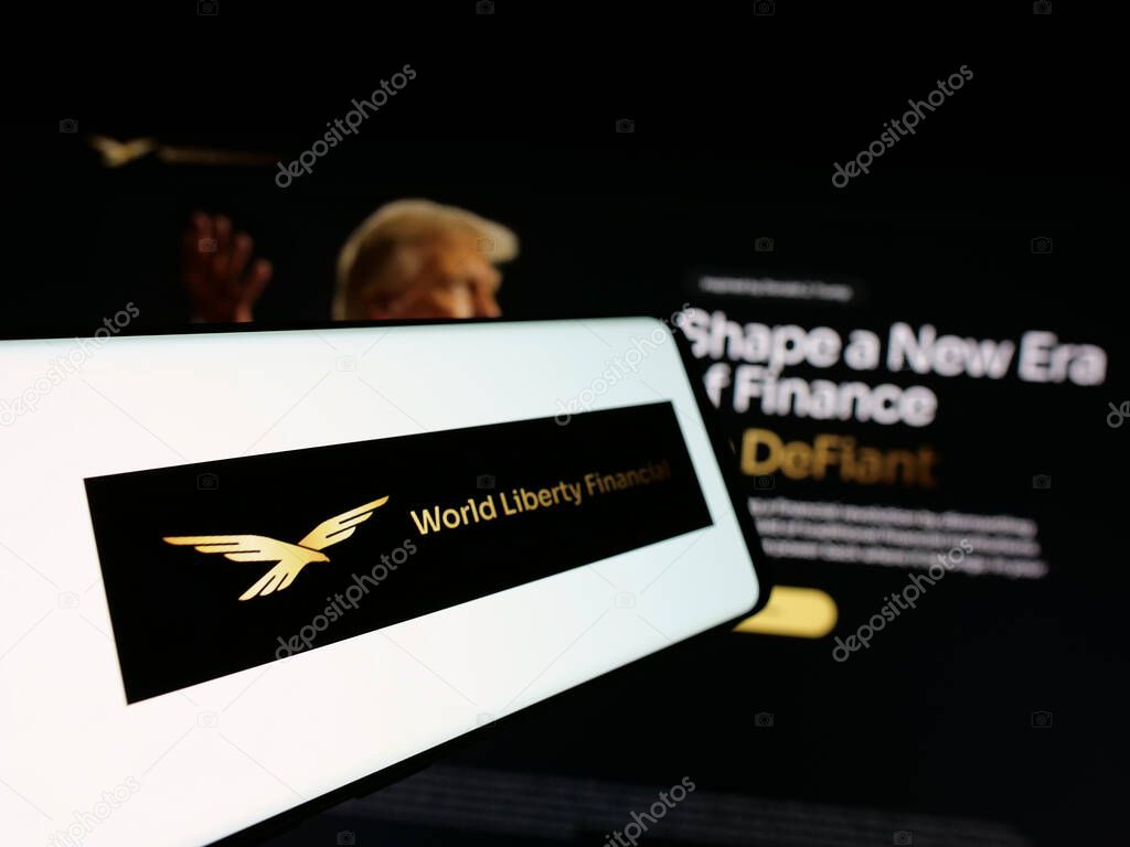 Stuttgart, Germany - 10-22-2024: Mobile phone with logo of US crypto company World Liberty Financial Inc. on screen in front of website. Focus on center-left of phone display.