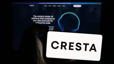 Stuttgart, Germany - 10-31-2024: Person holding mobile phone with logo of American AI company Cresta Intelligence Inc. on screen in front of website. Focus on phone display. clipart