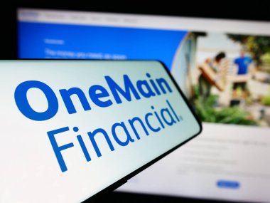 Stuttgart, Germany - 02-03-2024: Cellphone with logo of American financial services company OneMain Holdings Inc. in front of business website. Focus on left of phone display. clipart