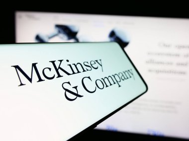 Stuttgart, Germany - 03-16-2024: Mobile phone with logo of American consulting business McKinsey and Company in front of website. Focus on center-left of phone display. clipart