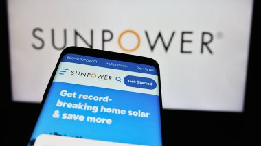 Stuttgart, Germany - 03-17-2024: Mobile phone with website of US photovoltaics company SunPower Corporation in front of business logo. Focus on top-left of phone display. clipart