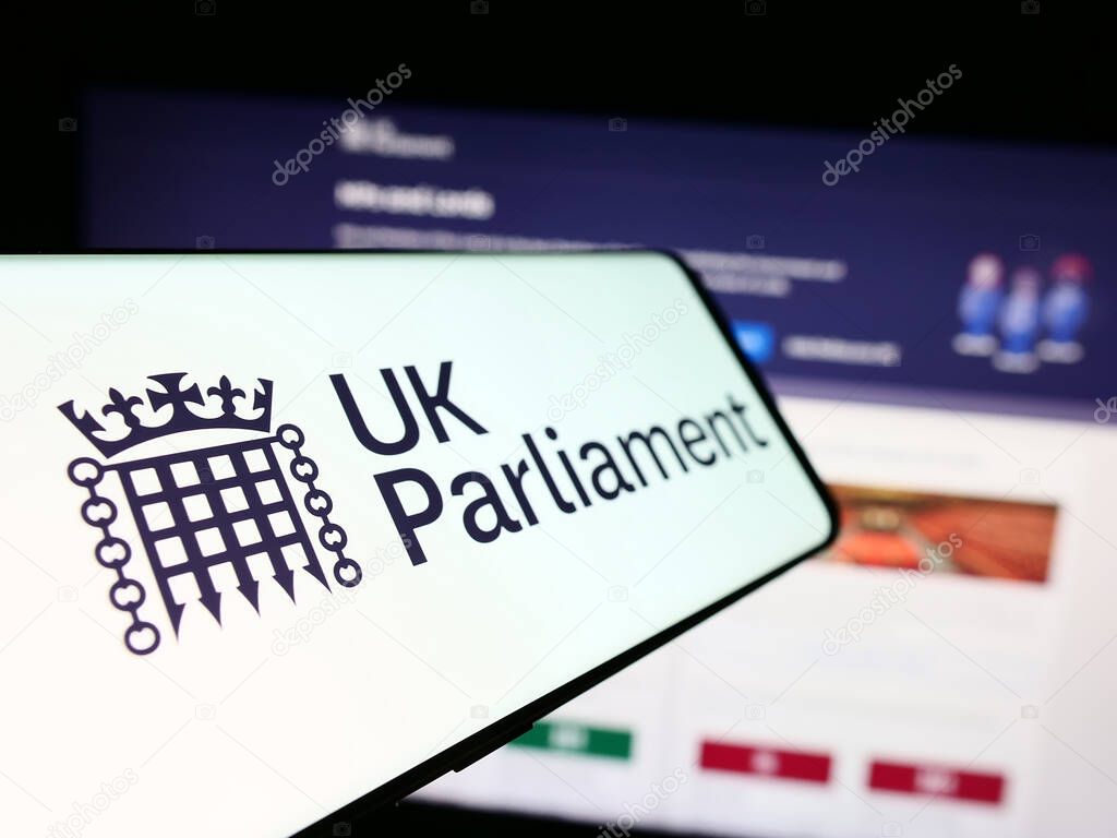 Stuttgart, Germany - 03-25-2024: Mobile phone with logo of legislative body Parliament of the United Kingdom (UK) in front of website. Focus on center-left of phone display.