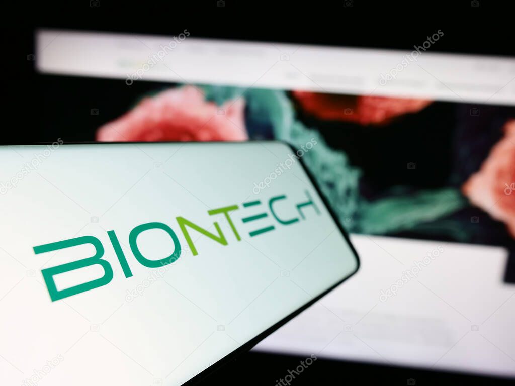 Stuttgart, Germany - 11-16-2023: Mobile phone with logo of German biotechnology company BioNTech SE in front of business website. Focus on left of phone display.