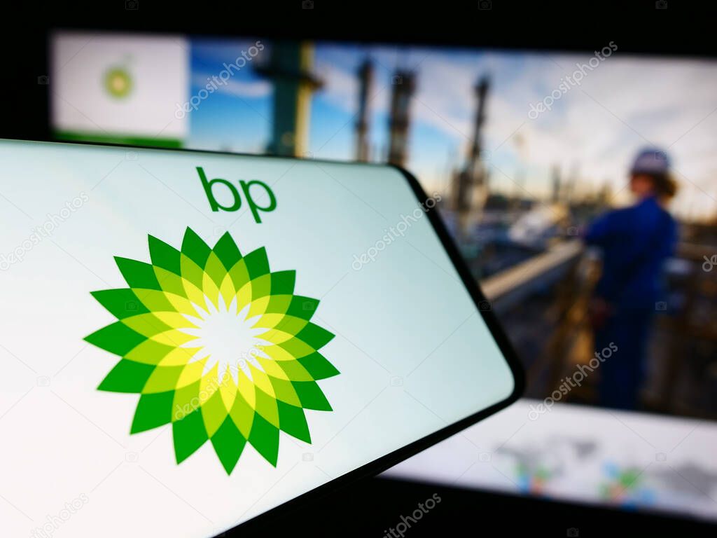 Stuttgart, Germany - 11-16-2023: Cellphone with logo of British oil and gas company BP plc  in front of business website. Focus on center-left of phone display.
