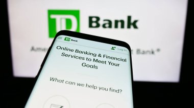 Stuttgart, Almanya - 11-21-2023: İş logosu önünde finans hizmetleri şirketi Toronto-Dominion Bank 'ın (TD) web siteli akıllı telefon. Telefon ekranının sol üst kısmına odaklan.