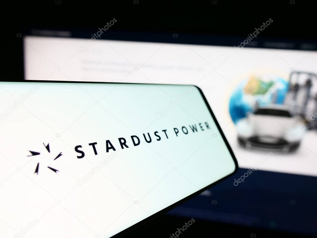Stuttgart, Germany - 11-30-2023: Mobile phone with logo of American lithium refining company Stardust Power Inc. in front of website. Focus on center-left of phone display.