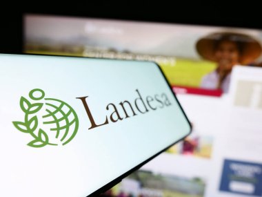 Stuttgart, Germany - 10-10-2023: Mobile phone with logo of American organization Landesa Rural Development Institute in front of website. Focus on left of phone display. clipart