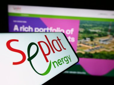 Stuttgart, Germany - 10-30-2023: Cellphone with logo of Nigerian oil company Seplat Energy plc in front of business website. Focus on center of phone display. clipart