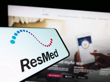 Stuttgart, Germany - 08-07-2023: Smartphone with logo of American medical equipment company ResMed Inc. on screen in front of website. Focus on center-right of phone display. clipart