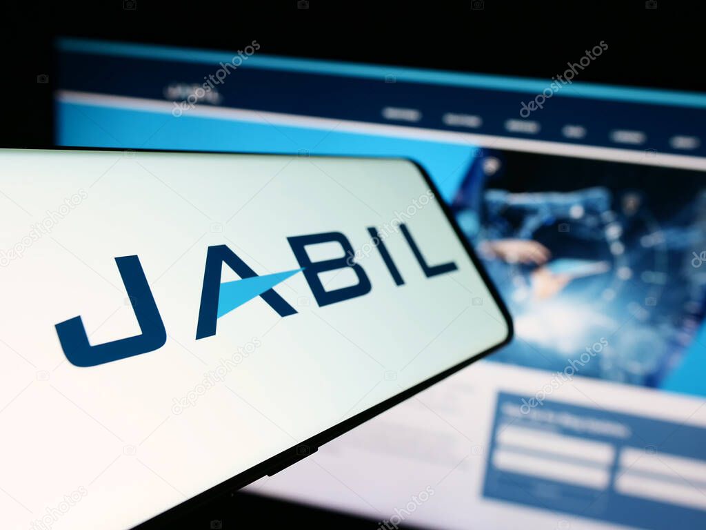 Stuttgart, Germany - 09-08-2023: Cellphone with logo of American electronics company Jabil Inc. on screen in front of business website. Focus on center-left of phone display.
