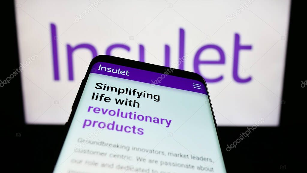 Stuttgart, Germany - 07-29-2023: Mobile phone with webpage of US medical device company Insulet Corporation on screen in front of logo. Focus on top-left of phone display.