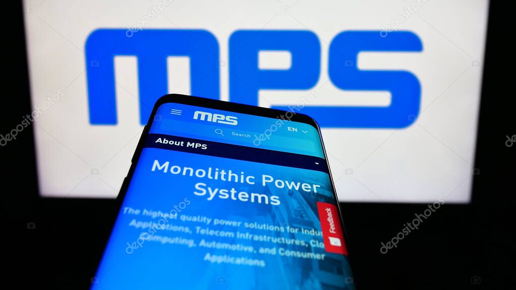 Stuttgart, Germany - 08-05-2023: Mobile phone with website of US company Monolithic Power Systems Inc. (MPS) on screen in front of logo. Focus on top-left of phone display.