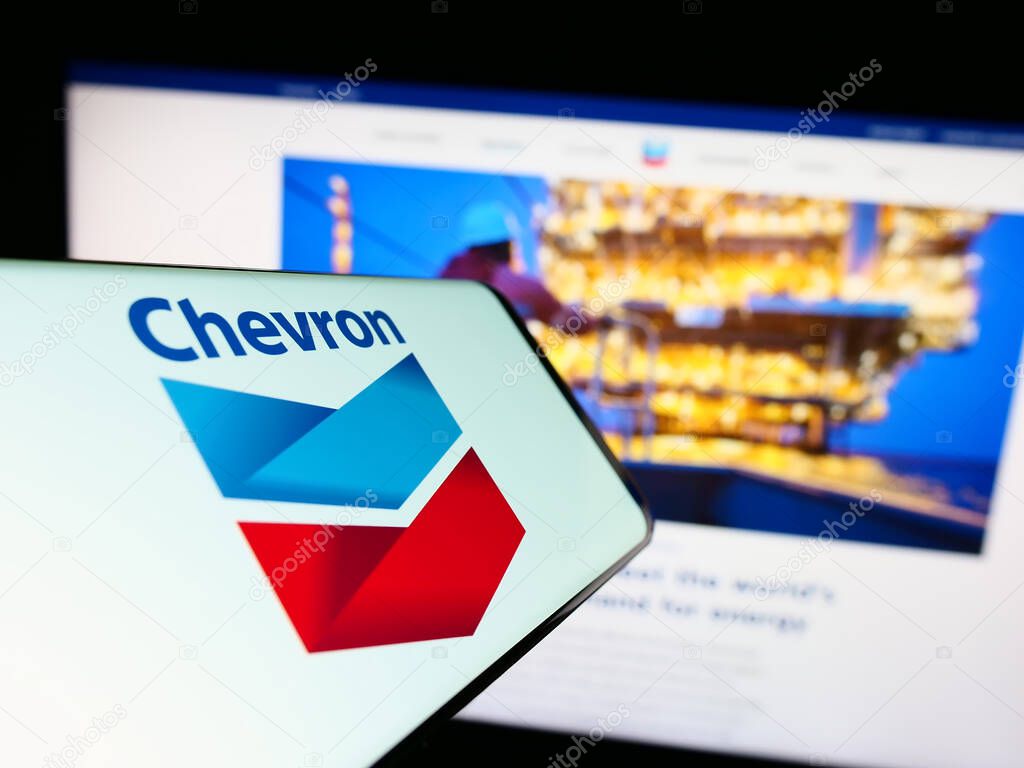 Stuttgart, Germany : 06-25-2023: Smartphone with logo of American energy company Chevron Corporation on screen in front of website. Focus on center-right og phone display.