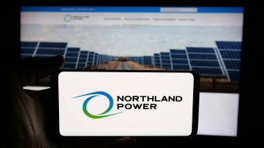 Stuttgart, Germany - 12-04-2024: Person holding cellphone with logo of Canadian energy company Northland Power Inc. on screen in front of business webpage. Focus on phone display. clipart