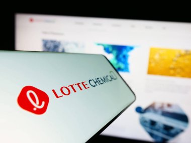 Stuttgart, Germany - 06-19-2023: Smartphone with logo of Korean company Lotte Chemical Corporation on screen in front of business website. Focus on center-left of phone display. clipart