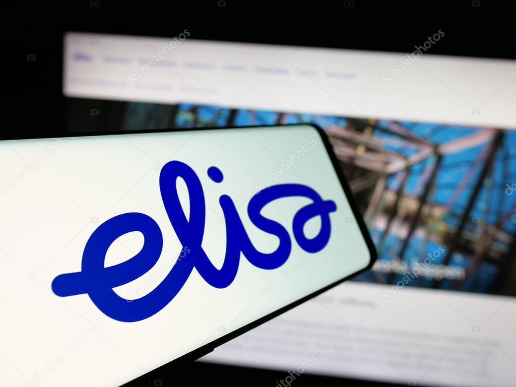 Stuttgart, Germany - 01-03-2024: Mobile phone with logo of Finnish telecommunications company Elisa Oyj on screen in front of website. Focus on center-left of phone display.