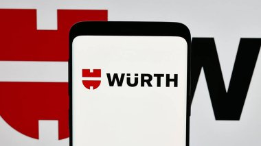 Stuttgart, Germany - 01-15-2025: Mobile phone with logo of German tools company Adolf Wuerth GmbH Co. KG on screen. Focus on phone display. clipart