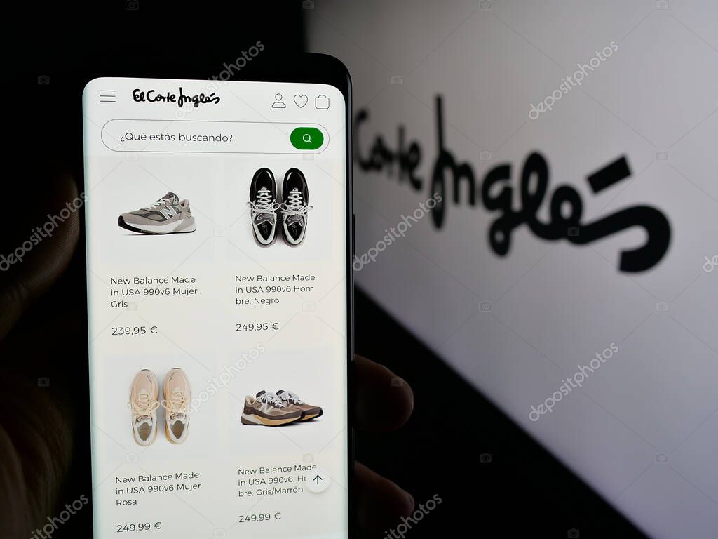 Stuttgart, Germany - 03-10-2025: Person holding cellphone with webpage of Spanish retail company El Corte Ingles S.A. on screen in front of logo. Focus on center of phone display.