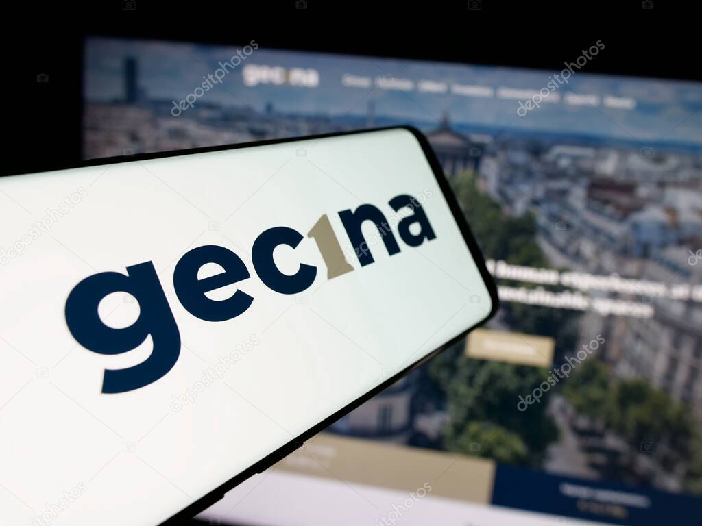 Stuttgart, Germany - 03-14-2025: Smartphone with logo of French real estate company Gecina S.A. on screen in front of website. Focus on center-left of phone display.