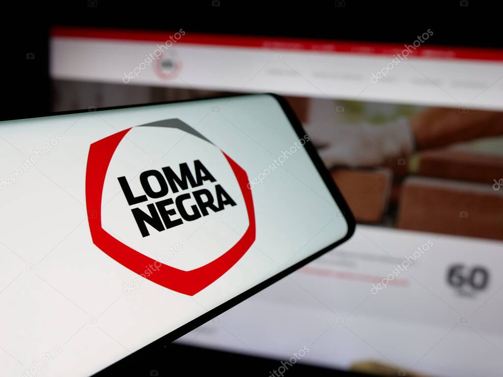 Stuttgart, Germany - 03-31-2025: Smartphone with logo of Loma Negra Compania Industrial Argentina S.A. on screen in front of website. Focus on center-left of phone display.