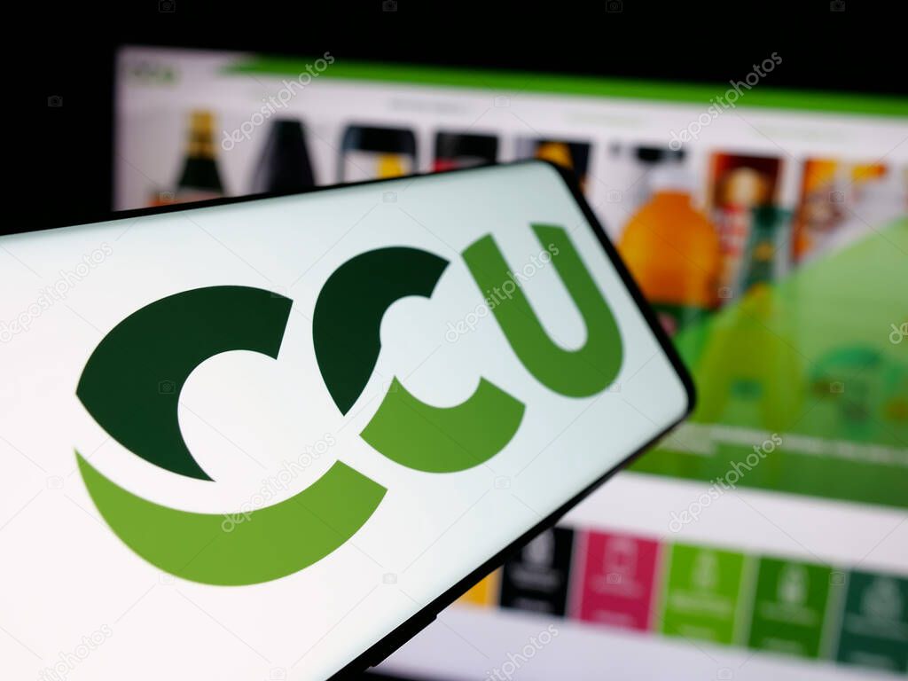Stuttgart, Germany - 04-03-2025: Smartphone with logo of Compania Cervecerias Unidas S.A. (CCU) on screen in front of website. Focus on center-left of phone display.