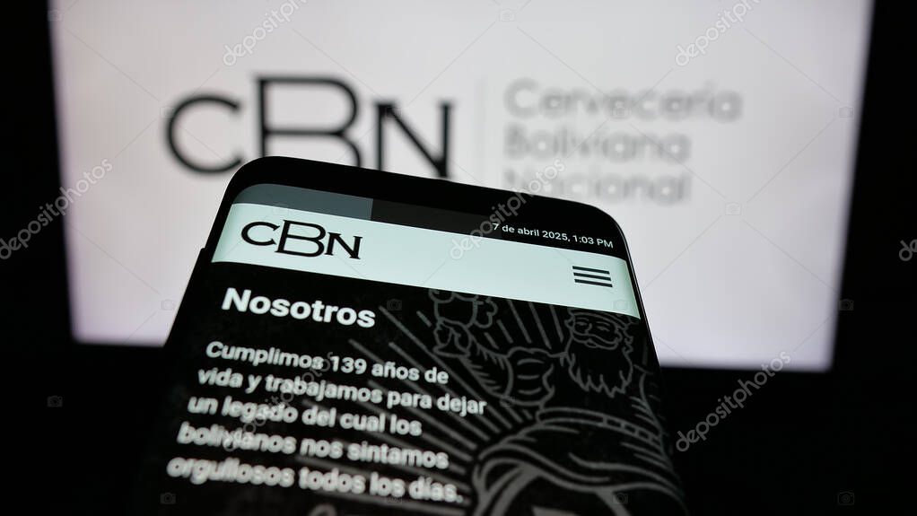 Stuttgart, Germany - 04-07-2025: Mobile phone with logo of company Cerveceria Boliviana Nacional (CBN) on screen in front of website. Focus on top-left of phone display.