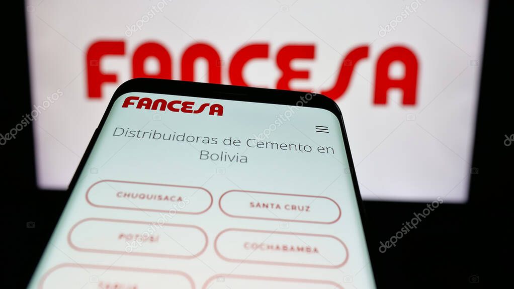 Stuttgart, Germany - 04-09-2025: Mobile phone with logo of company Fabrica Nacional de Cemento (FANCESA) on screen in front of website. Focus on top-left of phone display.