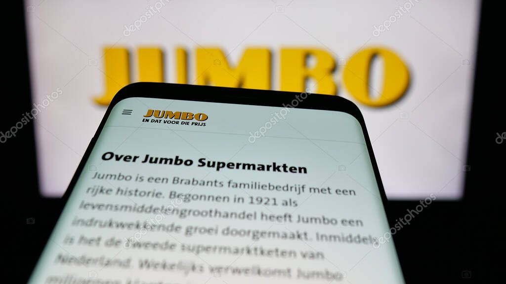 Stuttgart, Germany - 04-17-2025: Mobile phone with webpage of Dutch company Koninklijke Jumbo Food Groep on screen in front of logo. Focus on top-left of phone display.