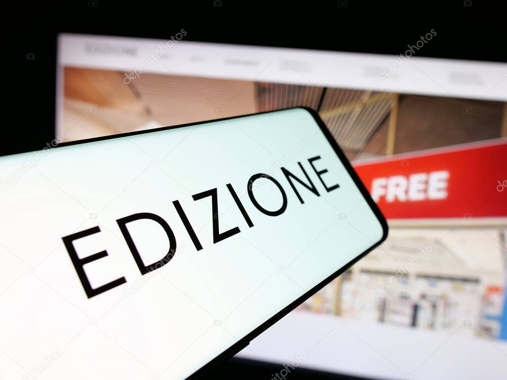 Stuttgart, Germany - 04-24-2025: Smartphone with logo of Italian investment company Edizione S.p.A. on screen in front of website. Focus on center of phone display.