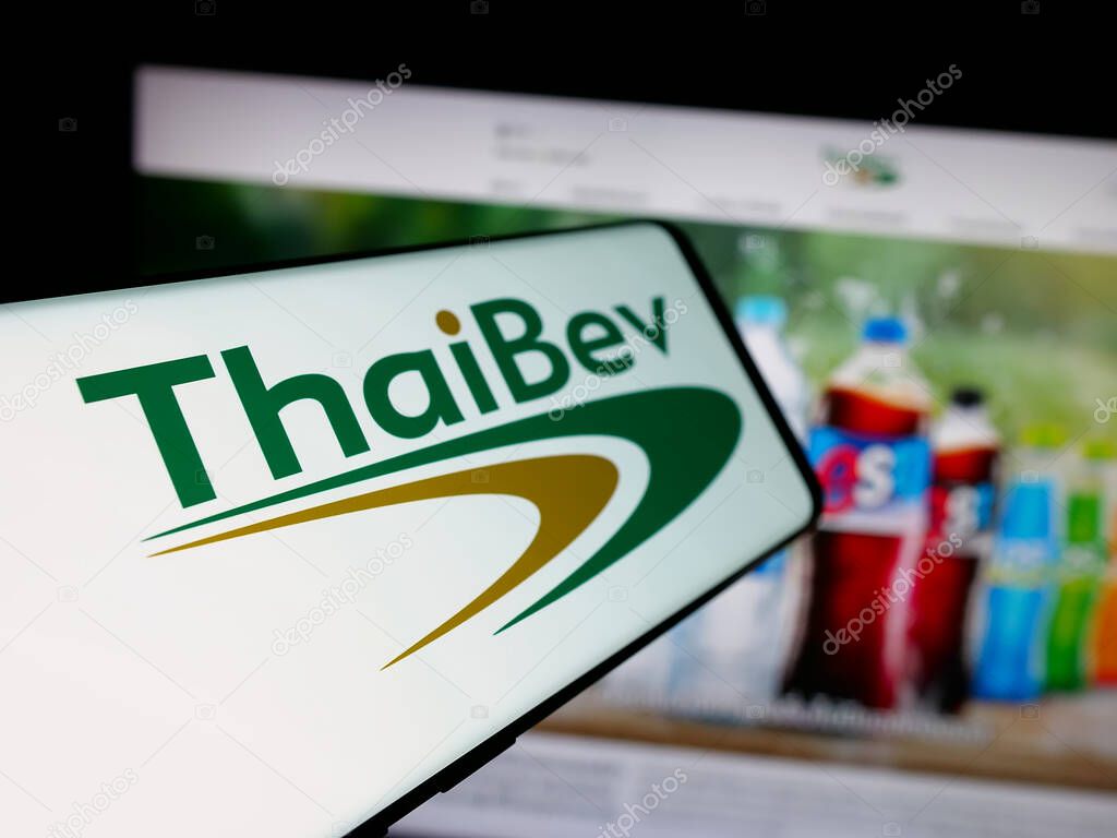Stuttgart, Germany - 05-02-2025: Smartphone with logo of company Thai Beverage plc (ThaiBev) on screen in front of website. Focus on center-left of phone display.