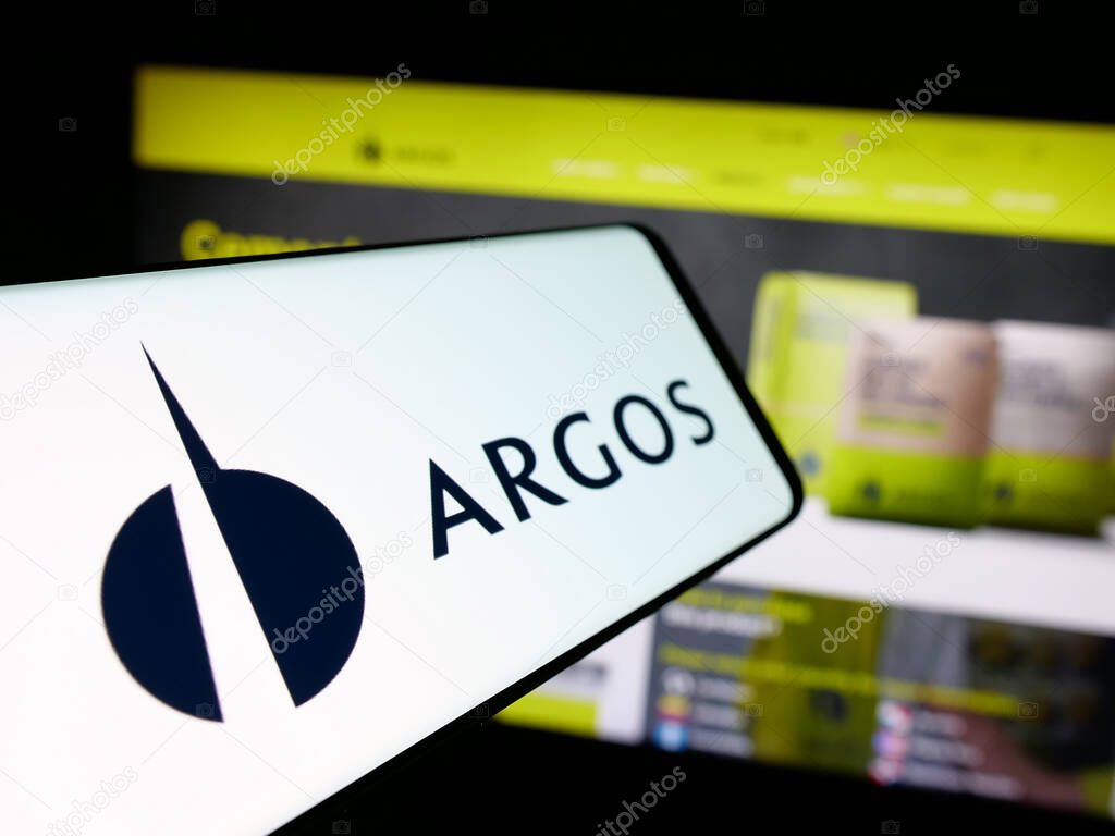 Stuttgart, Germany - 05-04-2025: Smartphone with logo of building materials company Grupo Argos S.A. on screen in front of website. Focus on center-left of phone display.
