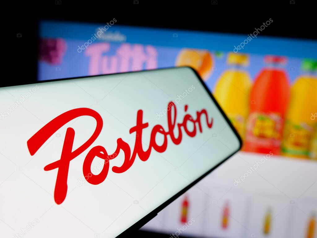 Stuttgart, Germany - 05-05-2025: Smartphone with logo of Colombian beverage company Postobon S.A. on screen in front of website. Focus on left of phone display.