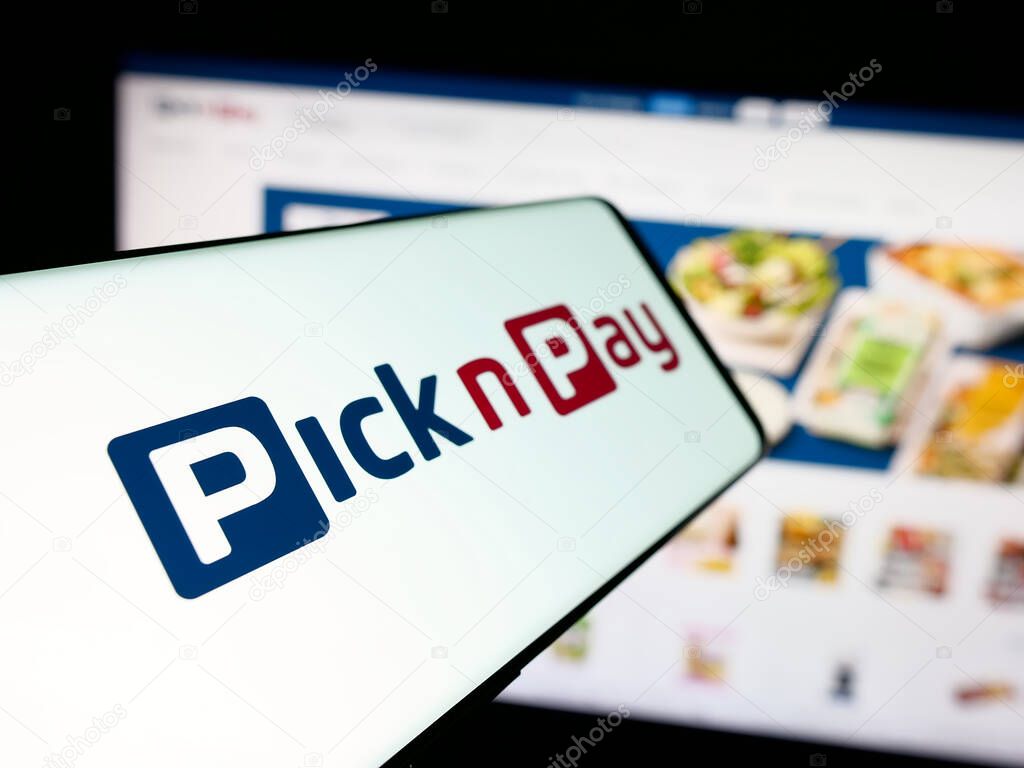 Stuttgart, Germany - 05-14-2025: Smartphone with logo of grocery retail company Pick n Pay Group Ltd. on screen in front of website. Focus on left of phone display.