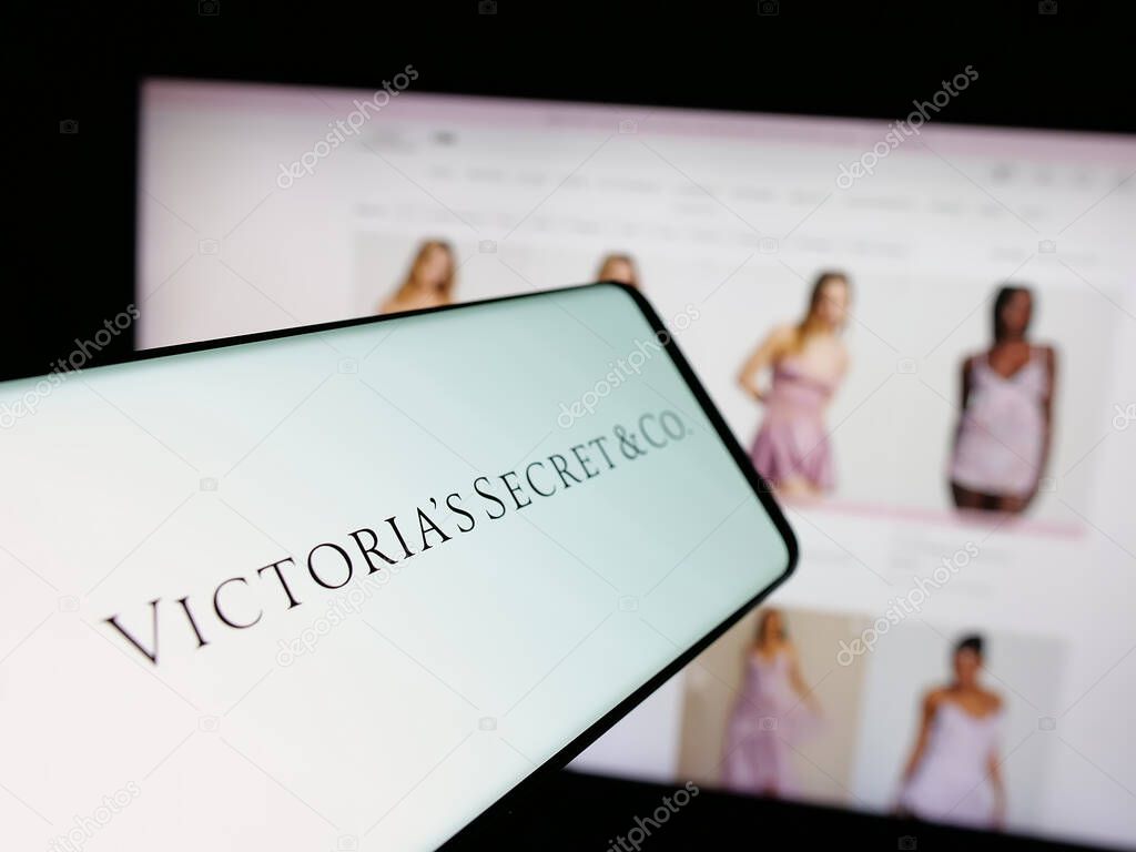 Stuttgart, Germany - 05-18-2025: Smartphone with logo of US lingerie company Victoria's Secret Co. on screen in front of website. Focus on center-left of phone display.