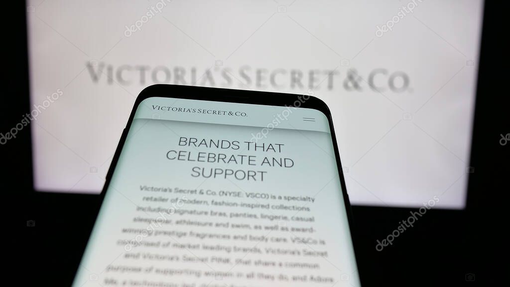 Stuttgart, Germany - 05-18-2025: Mobile phone with website of US lingerie company Victoria's Secret Co. on screen in front of logo. Focus on top-left of phone display.