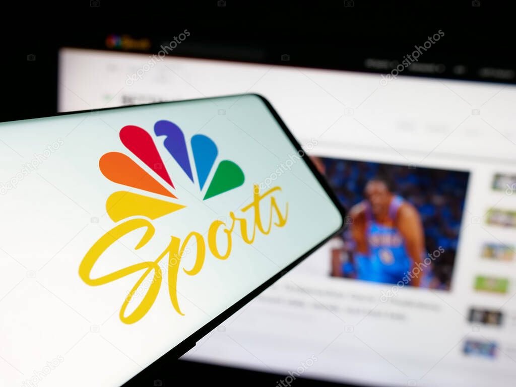 Stuttgart, Germany - 05-25-2025: Smartphone with logo of US television channel NBC Sports (NBCSports) on screen in front of website. Focus on center-left of phone display.