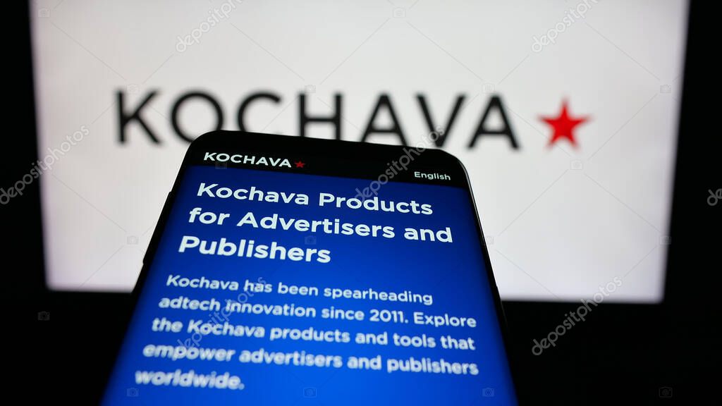 Stuttgart, Germany - 05-29-2025: Mobile phone with website of US data solutions company Kochava Inc. on screen in front of logo. Focus on top-left of phone display.