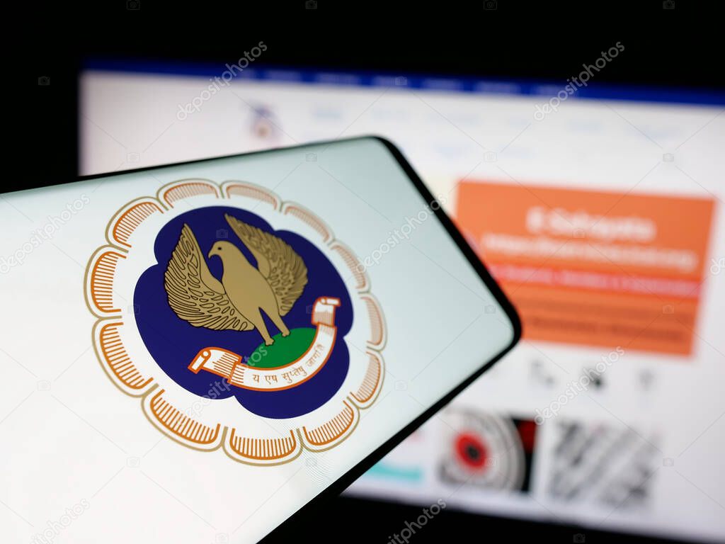 Stuttgart, Germany - 05-29-2025: Smartphone with logo of Institute of Chartered Accountants (ICAI) on screen in front of website. Focus on center-left of phone display.