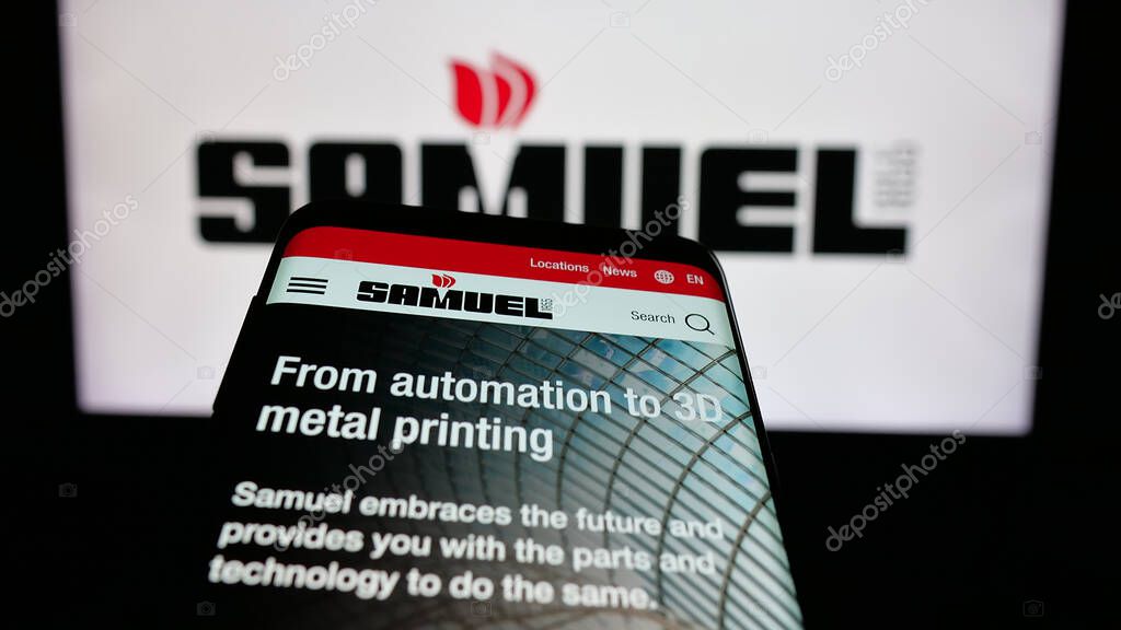 Stuttgart, Germany - 06-02-2025: Mobile phone with website of metal processing company Samuel Son Co. Inc. on screen in front of logo. Focus on top-left of phone display.