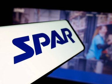 Stuttgart, Almanya - 06-06-2025: Web sitesi önünde ekranda ABD 'li perakende teknoloji şirketi Spar Inc.' in logosuna sahip akıllı telefon. Telefon ekranının merkez soluna odaklan.
