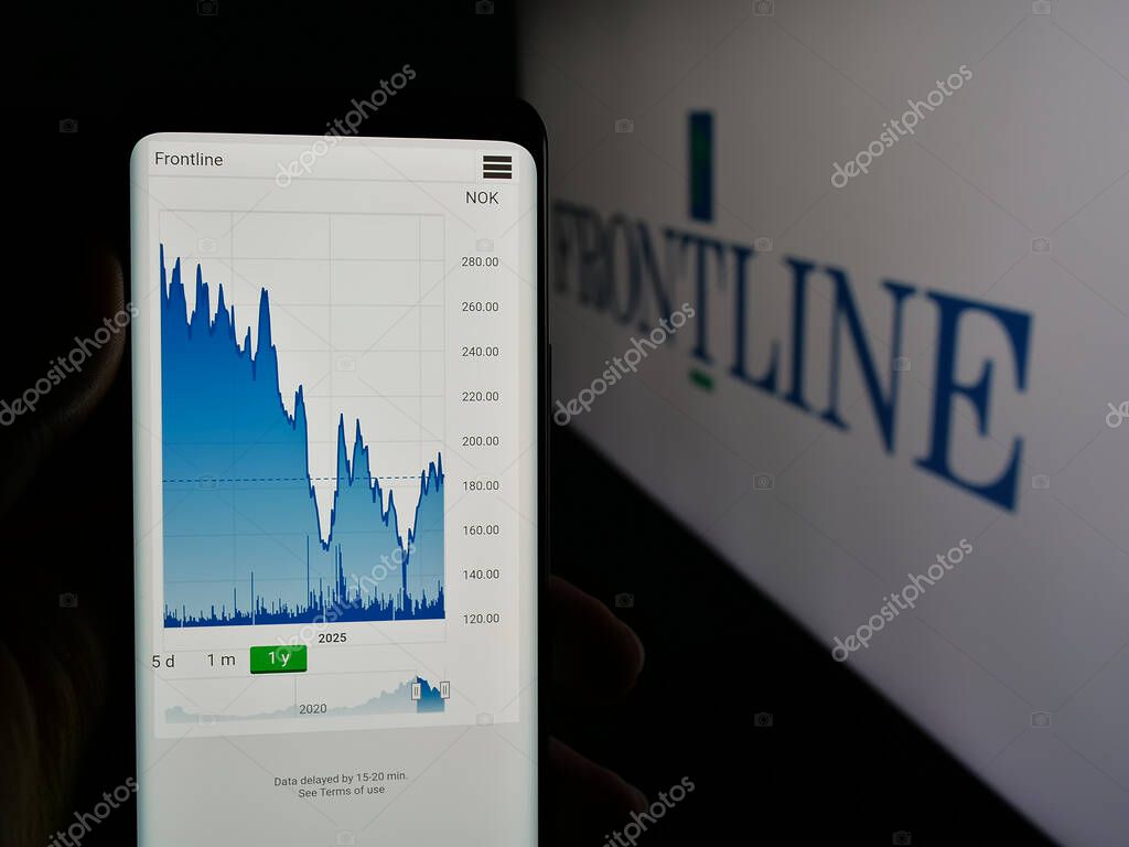 Stuttgart, Germany - 06-06-2025: Person holding smartphone with web page of oil tanker shipping company Frontline plc on screen in front of logo. Focus on center of phone display.