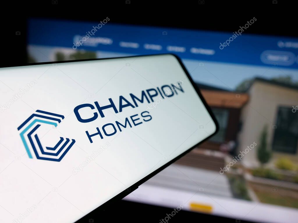 Stuttgart, Germany - 06-06-2025: Smartphone with logo of US homebuilding company Champion Homes Inc. on screen in front of website. Focus on center-left of phone display.