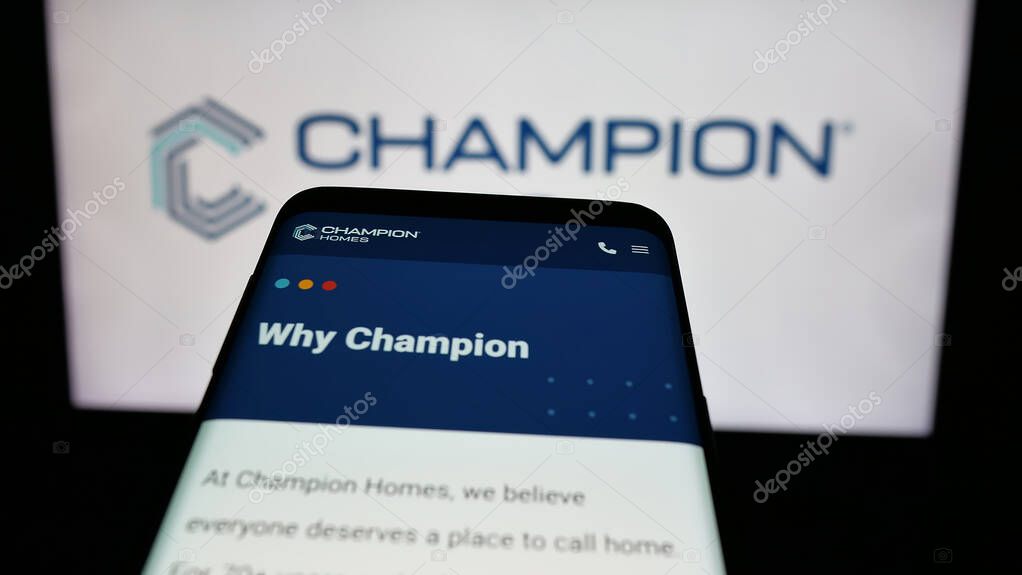 Stuttgart, Germany - 06-06-2025: Mobile phone with website of US homebuilding company Champion Homes Inc. on screen in front of logo. Focus on top-left of phone display.