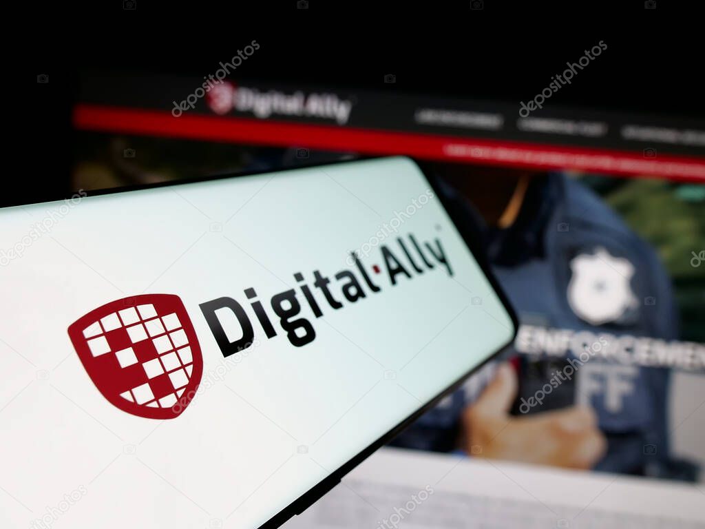 Stuttgart, Germany - 06-07-2025: Smartphone with logo of US video solutions company Digital Ally Inc. on screen in front of website. Focus on left of phone display.