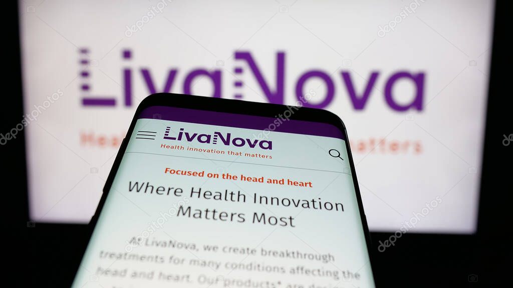 Stuttgart, Germany - 06-07-2025: Mobile phone with website of medical device company LivaNova plc on screen in front of logo. Focus on top-left of phone display.