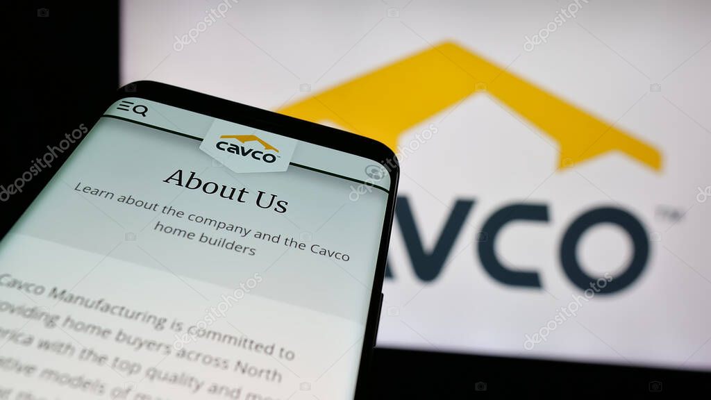 Stuttgart, Germany - 06-07-2025: Mobile phone with website of US homebuilding company Cavco Industries Inc. on screen in front of logo. Focus on top-left of phone display.