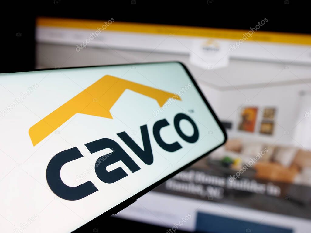 Stuttgart, Germany - 06-07-2025: Smartphone with logo of US homebuilding company Cavco Industries Inc. on screen in front of website. Focus on left of phone display.