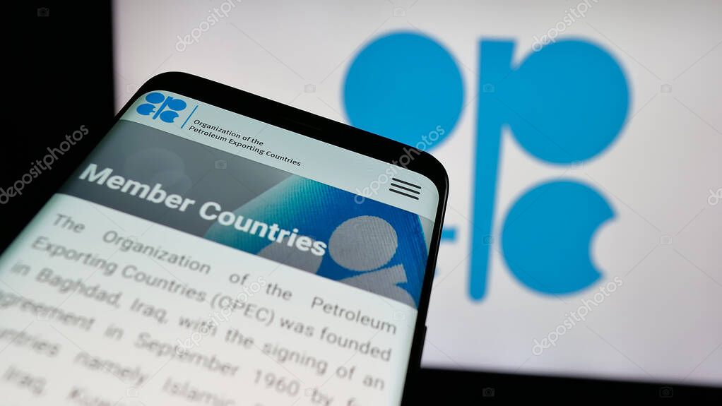 Stuttgart, Germany - 06-08-2025: Mobile phone with website of petroleum exporting organization OPEC on screen in front of logo. Focus on top-left of phone display.