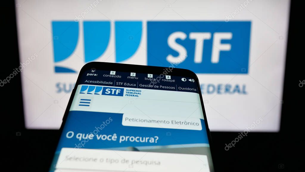 Stuttgart, Germany - 06-09-2025: Mobile phone with website of Brazil court Supremo Tribunal Federal (STF) on screen in front of logo. Focus on top-left of phone display.